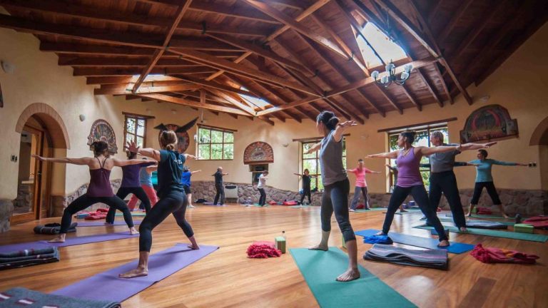 Yoga-class-at-Willka-T'ika-Wellness-Retreat-Peru-by-Art-in-Voyage-Yoga-at-Amatierra-Retreat-Center-Costa-Rica-by-Art-In-Voyage-Beach-front-Gurney's-Montauk-Resort-New-York-by Art-In-Voyage-Wellness Retreat | The Year of Wellness Travel is Upon Us