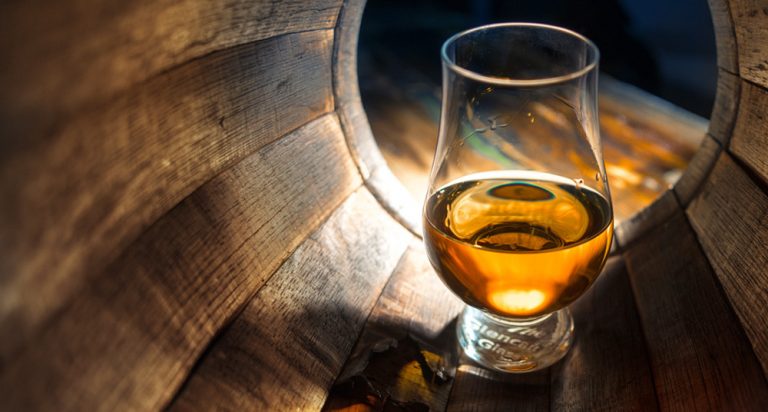 Glass of whisky in a barrel, by Art In Voyage